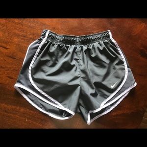 Grey nike shorts with light purple trim